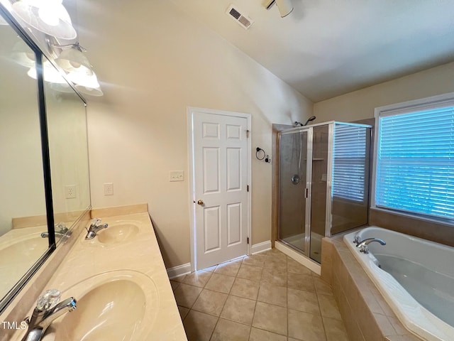 bathroom with shower with separate bathtub, lofted ceiling, tile patterned floors, and vanity