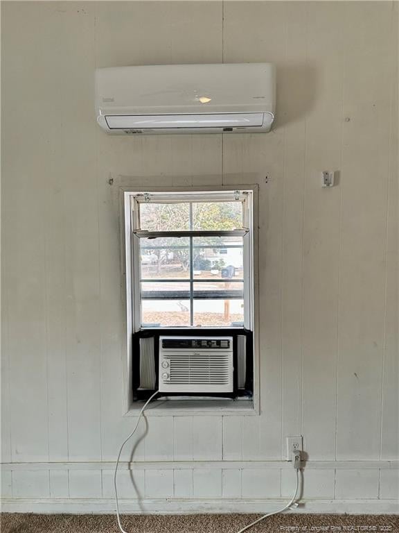 interior details featuring cooling unit and a wall mounted air conditioner