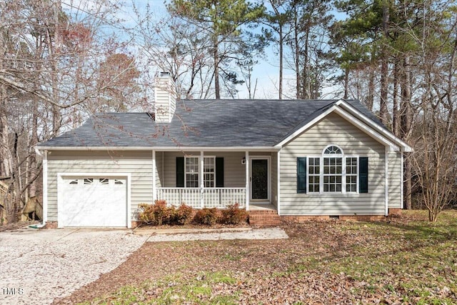 ranch-style home with driveway, an attached garage, covered porch, a chimney, and crawl space