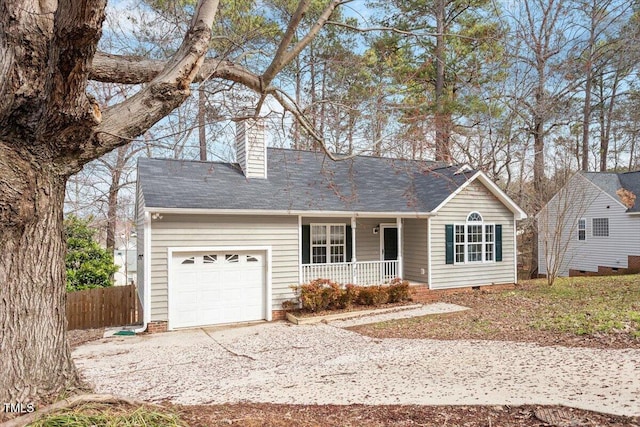 view of front of property with fence, covered porch, a chimney, driveway, and an attached garage