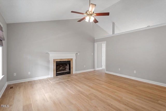 unfurnished living room featuring visible vents, light wood-style flooring, a fireplace, baseboards, and ceiling fan