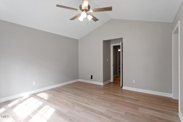 unfurnished room with light wood-type flooring, lofted ceiling, baseboards, and ceiling fan