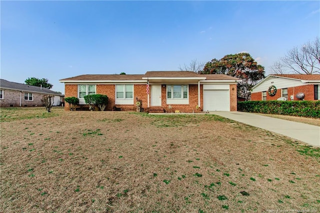 single story home featuring a garage and a front lawn