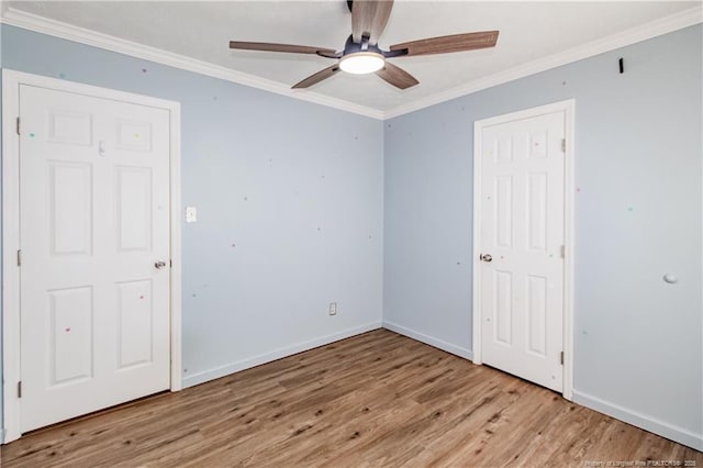 unfurnished room with crown molding, light hardwood / wood-style floors, and ceiling fan