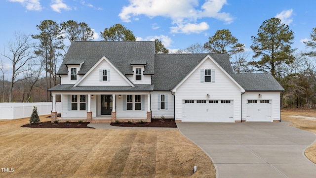 view of front of house with covered porch and a front lawn