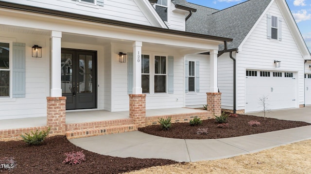 property entrance with a garage and covered porch