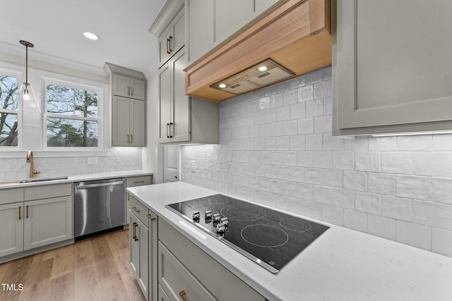 kitchen with sink, gray cabinetry, black electric cooktop, stainless steel dishwasher, and custom range hood