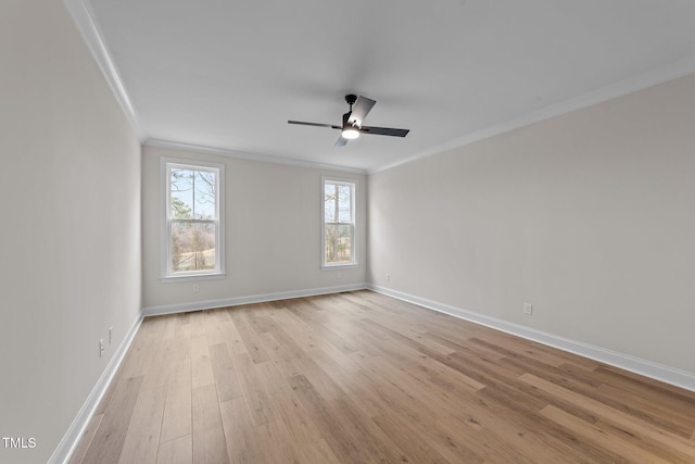 empty room with ornamental molding, ceiling fan, and light wood-type flooring