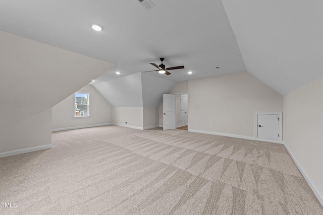 bonus room with lofted ceiling, light colored carpet, and ceiling fan