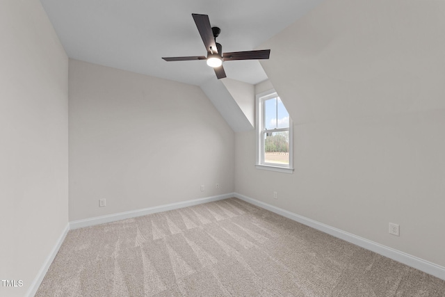 bonus room featuring light carpet, vaulted ceiling, and ceiling fan