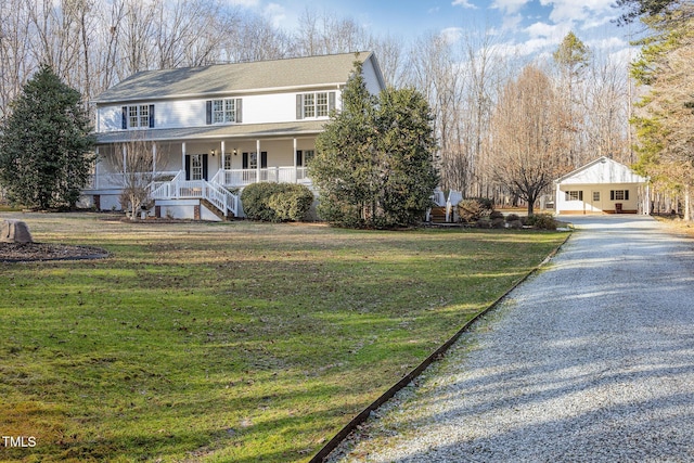 view of front facade with a front lawn and covered porch