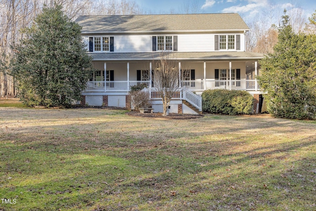 farmhouse-style home featuring a front yard and covered porch