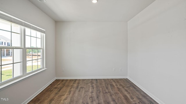 empty room featuring dark wood-type flooring