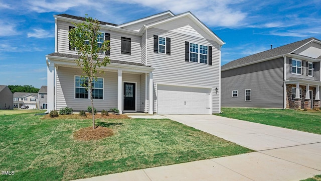 view of front of home featuring a garage and a front yard