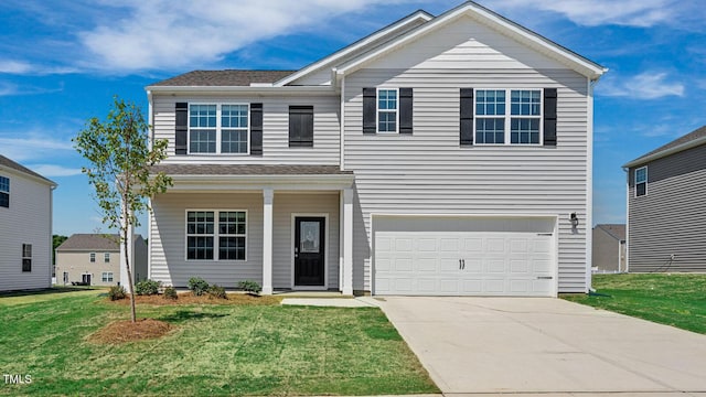 view of front of house with a garage and a front lawn