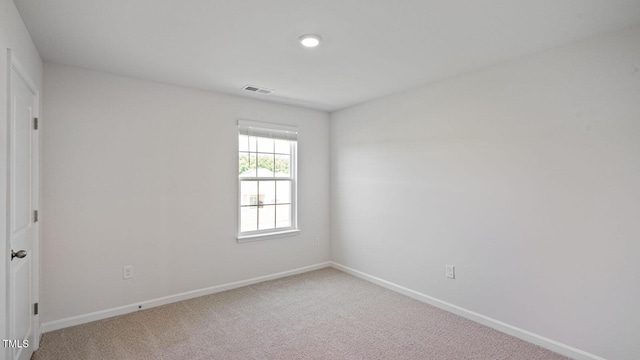 spare room with carpet floors