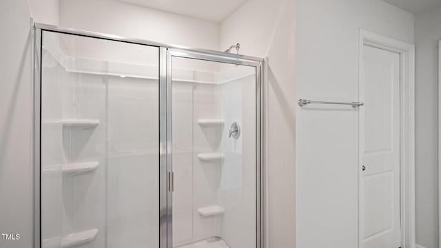 bathroom with an enclosed shower