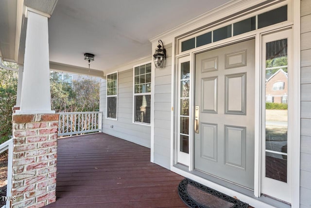 property entrance featuring covered porch