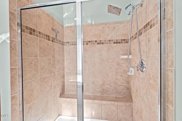 bathroom featuring a shower stall