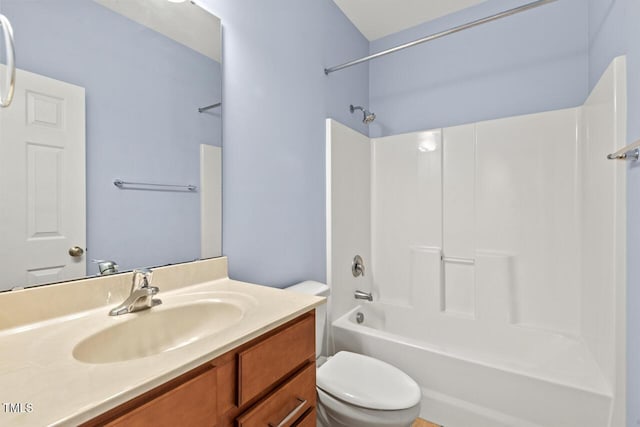 full bathroom featuring shower / washtub combination, vanity, and toilet