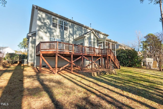 rear view of property with central air condition unit, stairs, a lawn, and a wooden deck