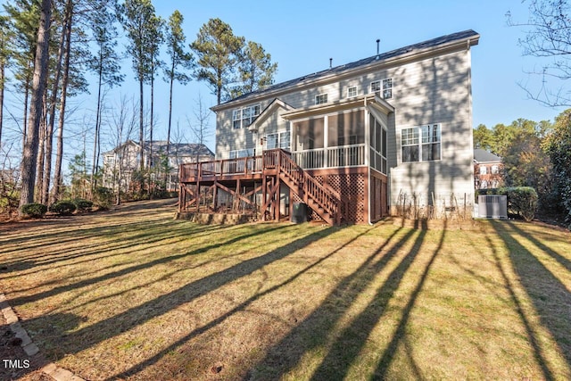 back of house with stairs, a yard, central AC, and a sunroom