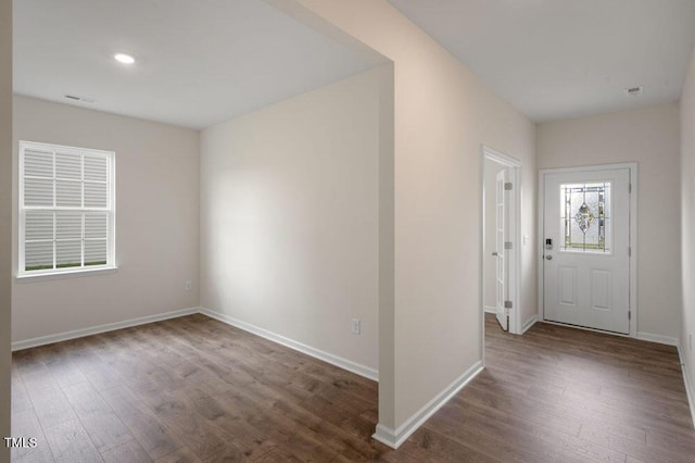 foyer entrance with dark hardwood / wood-style flooring