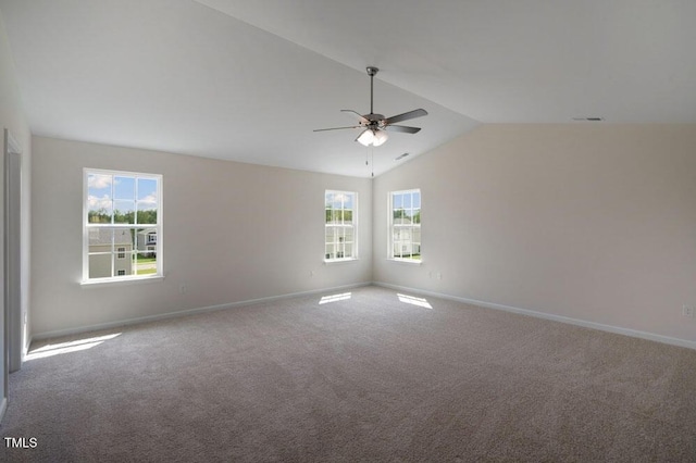 unfurnished room with ceiling fan, vaulted ceiling, and carpet