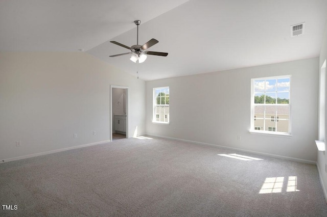 carpeted spare room with lofted ceiling and ceiling fan