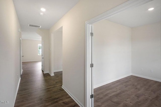 hallway with dark wood-type flooring