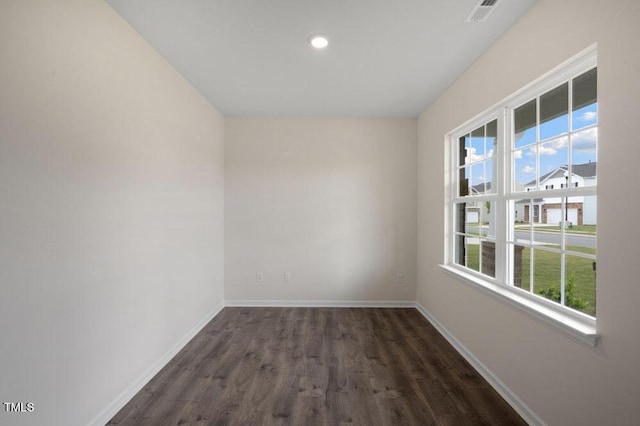 empty room with dark hardwood / wood-style floors