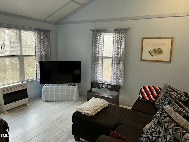 living room featuring lofted ceiling and heating unit