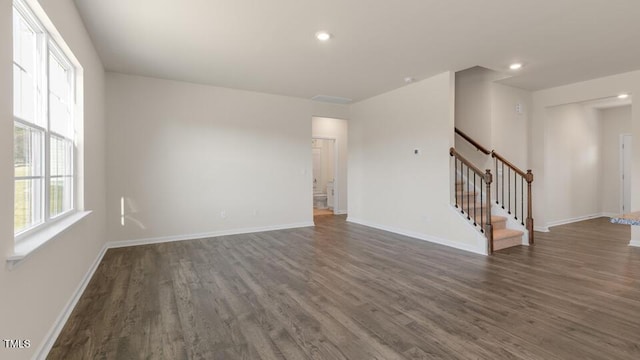 unfurnished room featuring dark hardwood / wood-style flooring