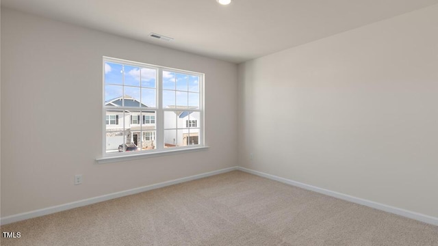 empty room with carpet flooring