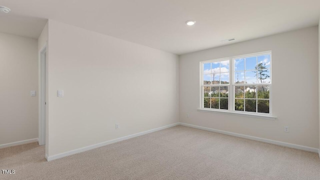 view of carpeted spare room