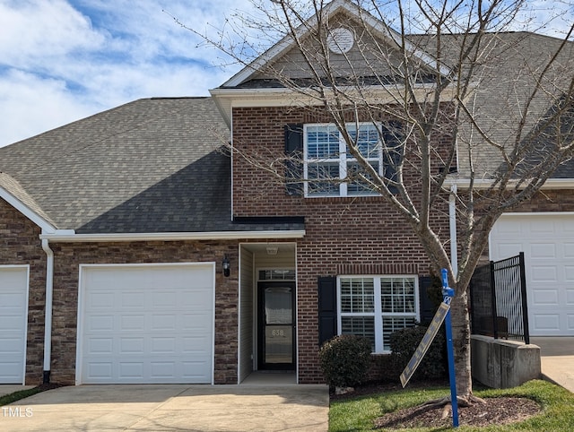 view of front of house with concrete driveway, brick siding, a garage, and a shingled roof