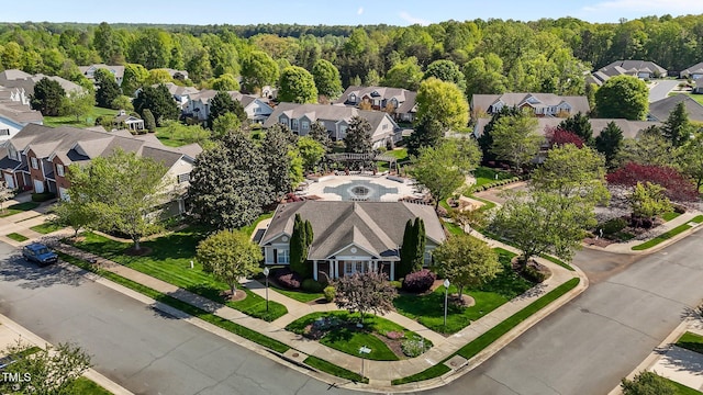 aerial view featuring a residential view and a wooded view
