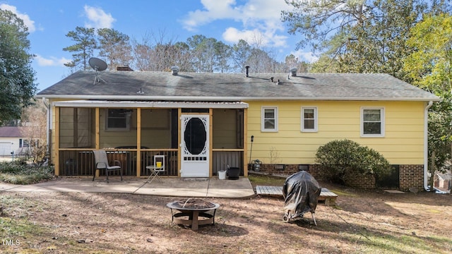 back of house featuring crawl space, a patio area, an outdoor fire pit, and roof with shingles