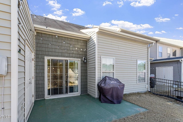 back of house with a patio