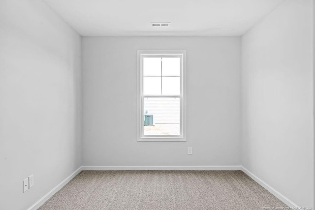 821 Tori Dr, Spring Lake, NC 28390 - spare room featuring carpet floors and baseboards