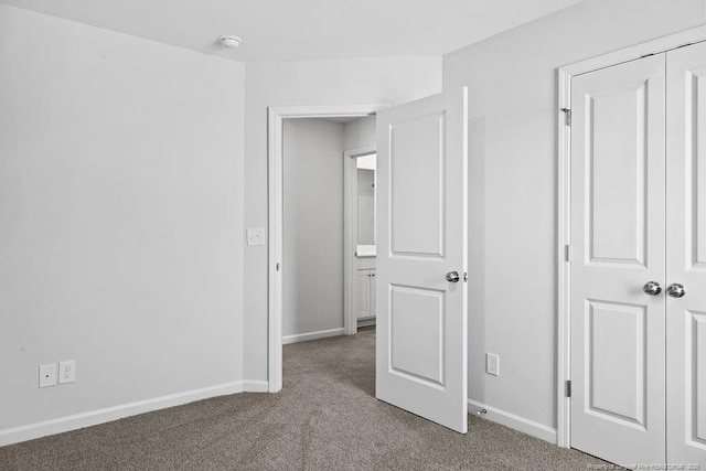 821 Tori Dr, Spring Lake, NC 28390 - unfurnished bedroom with carpet, baseboards, and a closet