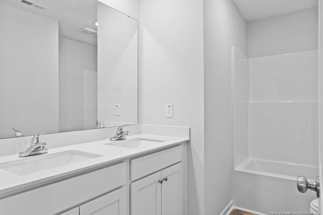 821 Tori Dr, Spring Lake, NC 28390 - bathroom featuring double vanity and shower / tub combination