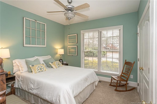 carpeted bedroom featuring ceiling fan