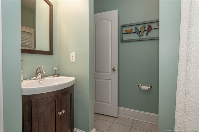 bathroom with tile patterned flooring and vanity