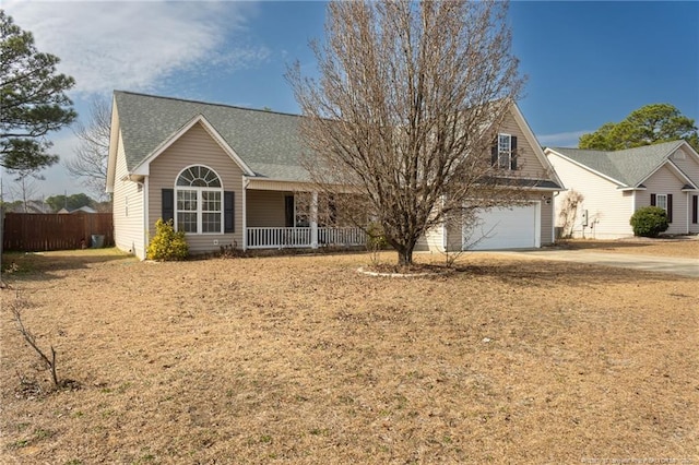 view of front of home with a garage and a porch