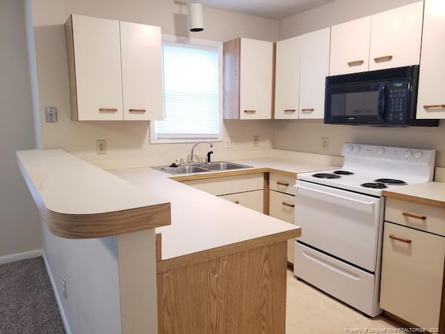 kitchen featuring white cabinetry, kitchen peninsula, sink, and electric range