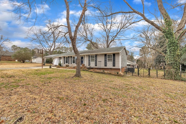 single story home with central AC unit and a front lawn