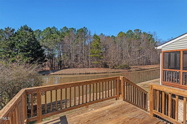 wooden terrace featuring a water view and a sunroom