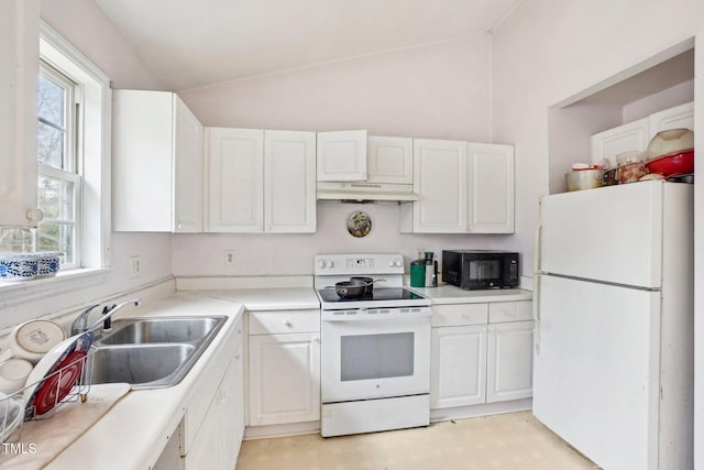 kitchen featuring white cabinetry, sink, white appliances, and vaulted ceiling