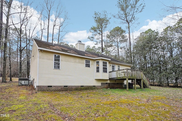 back of house with a yard, central AC, and a deck